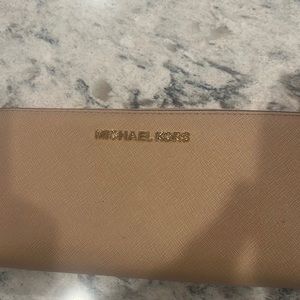A Michael Kors wallet.